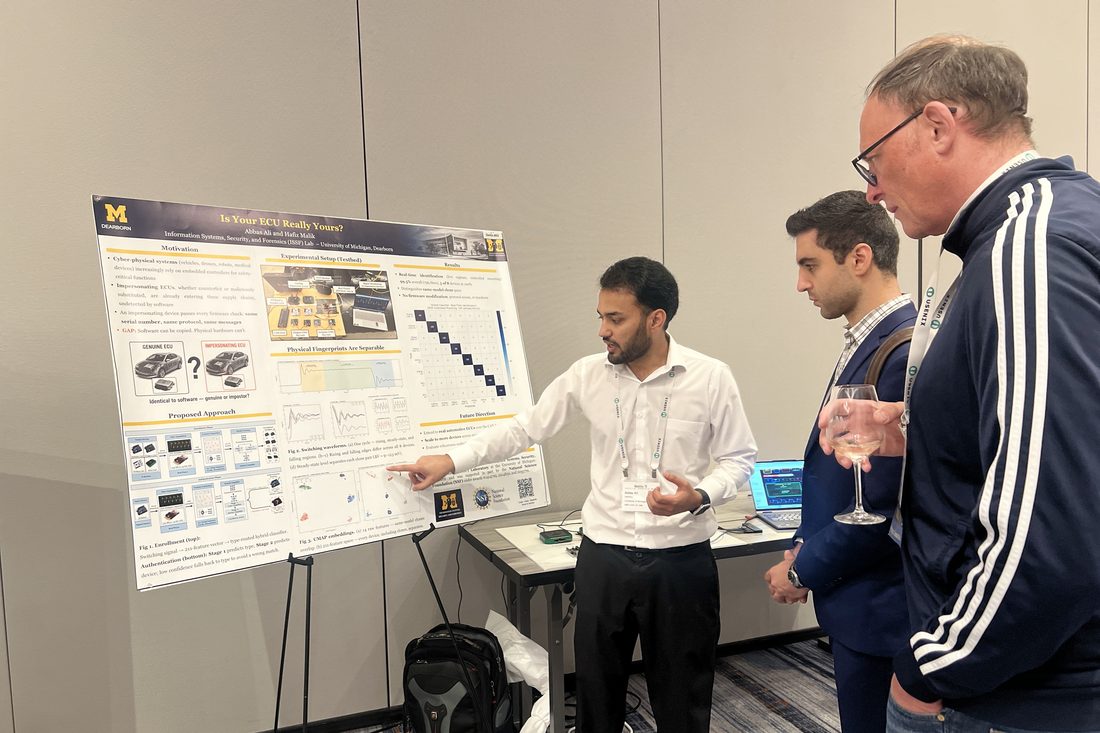 Presenting the live hardware demonstration at USENIX VehicleSec 2026